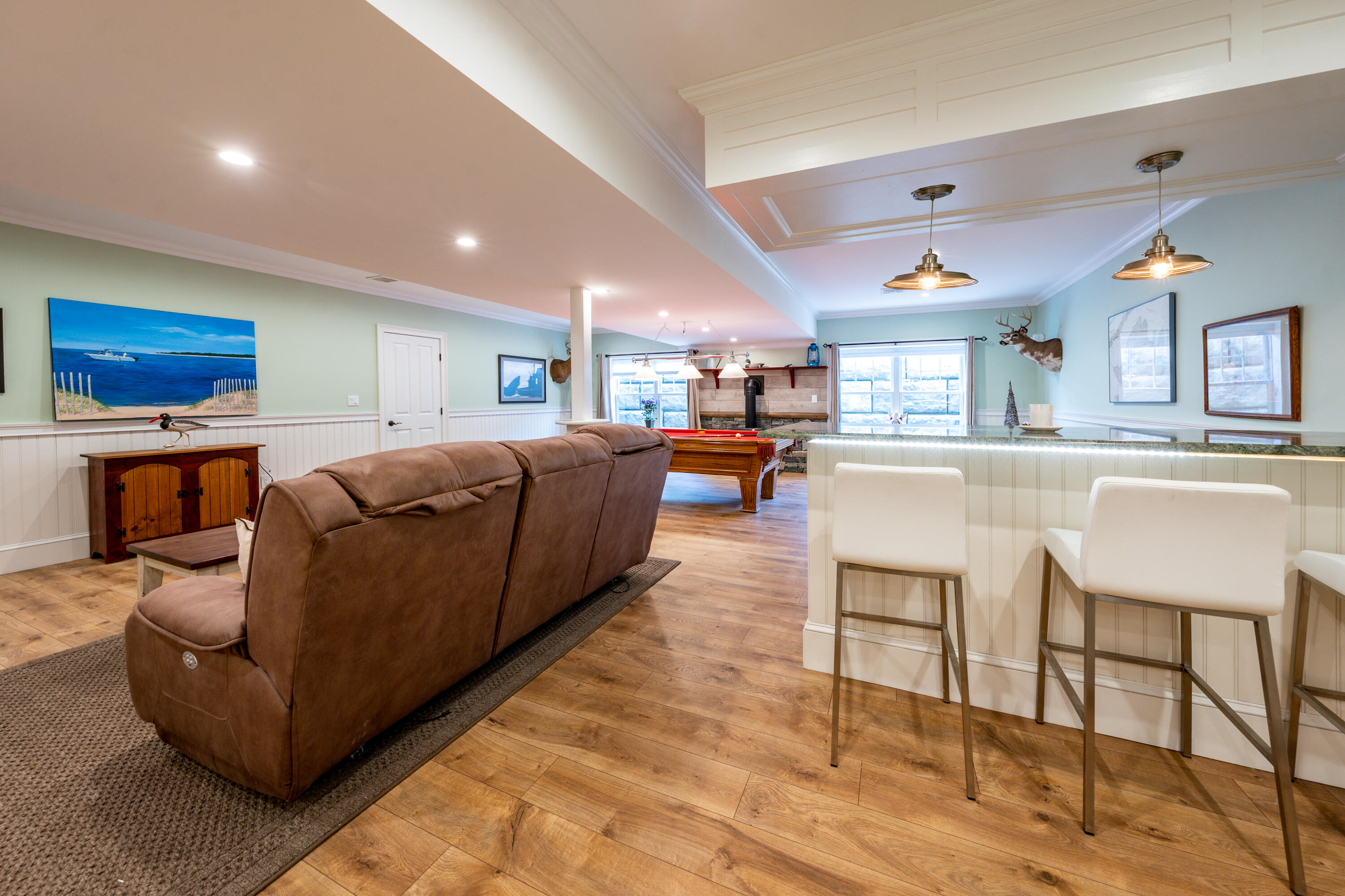 21 Jillian Drive Bourne, MA 02532 - Photo 32 of 46 a living room with furniture a rug kitchen view and a large window
