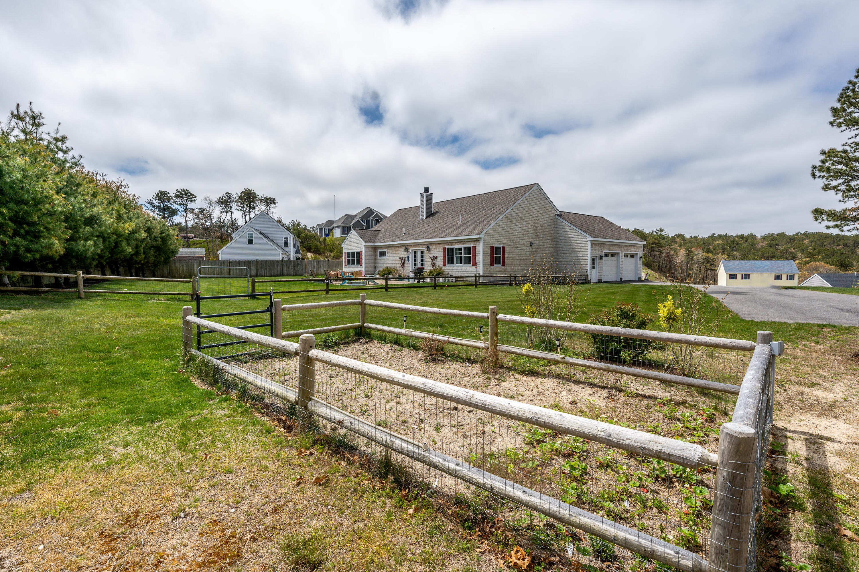21 Jillian Drive Bourne, MA 02532 - Photo 39 of 46 an aerial view of a house with a garden and lake view