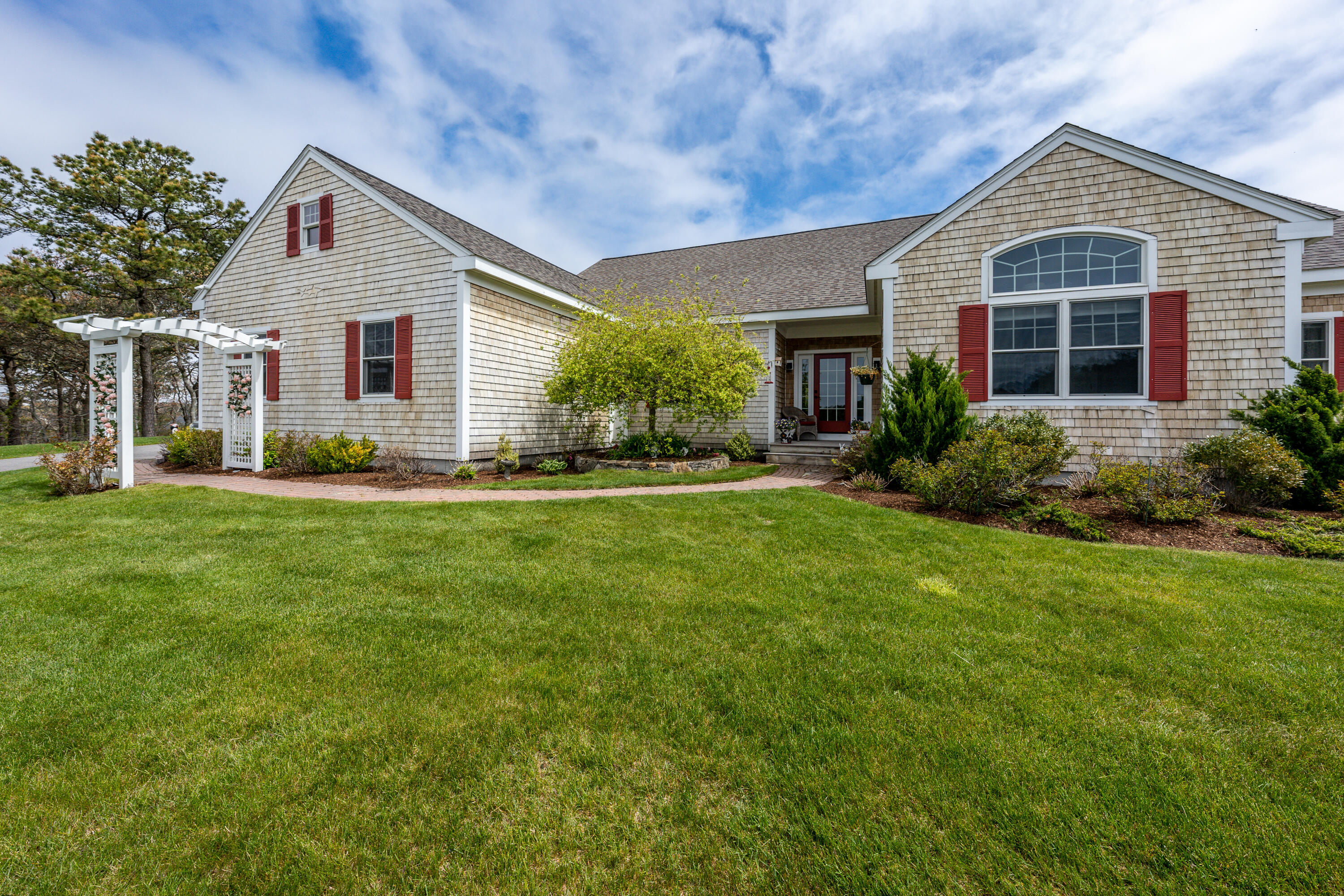 21 Jillian Drive Bourne, MA 02532 - Photo 4 of 46 a front view of house with yard and green space