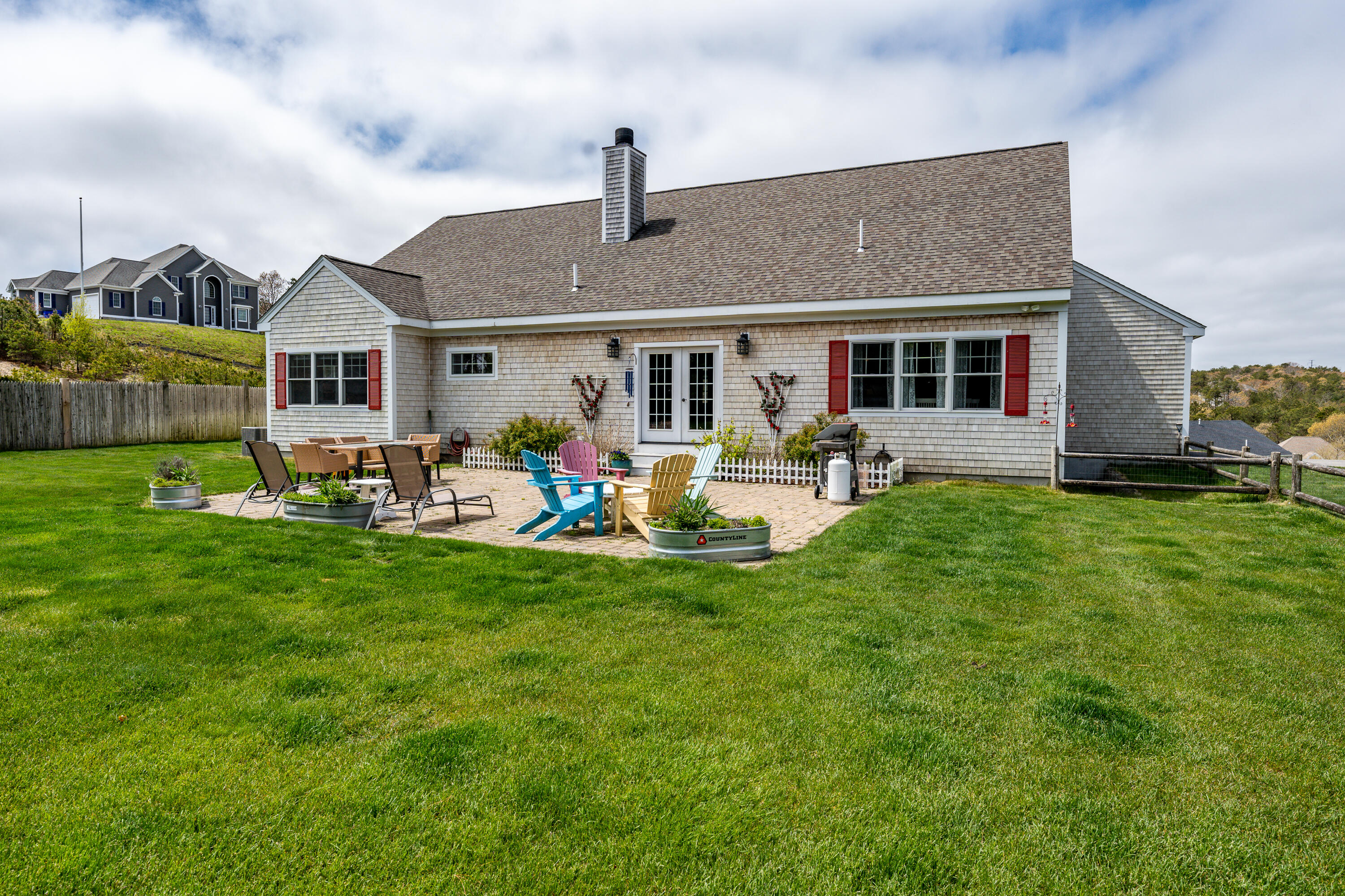 21 Jillian Drive Bourne, MA 02532 - Photo 41 of 46 a front view of house with yard and outdoor seating