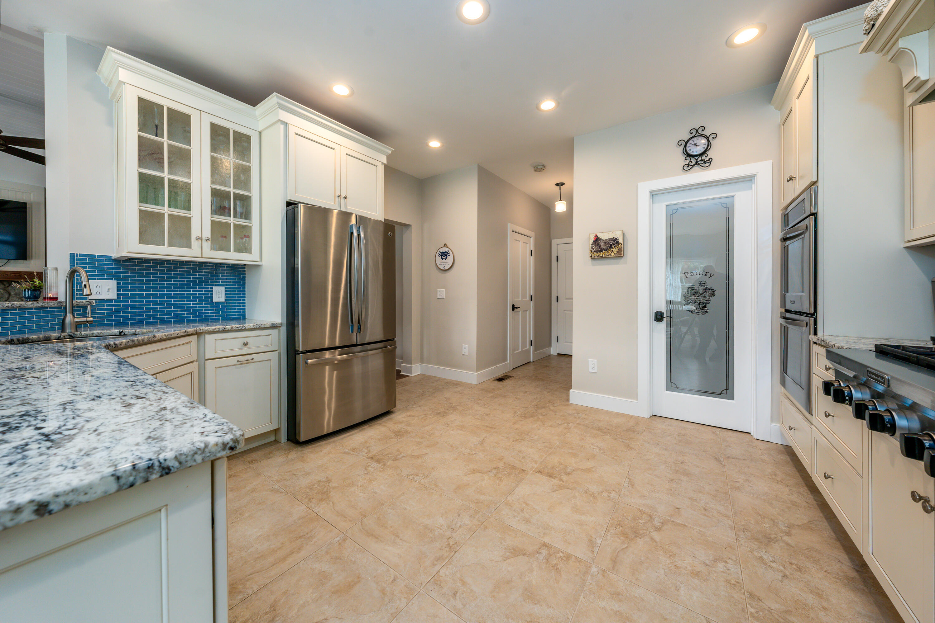21 Jillian Drive Bourne, MA 02532 - Photo 10 of 46 a kitchen with granite countertop a refrigerator and a sink