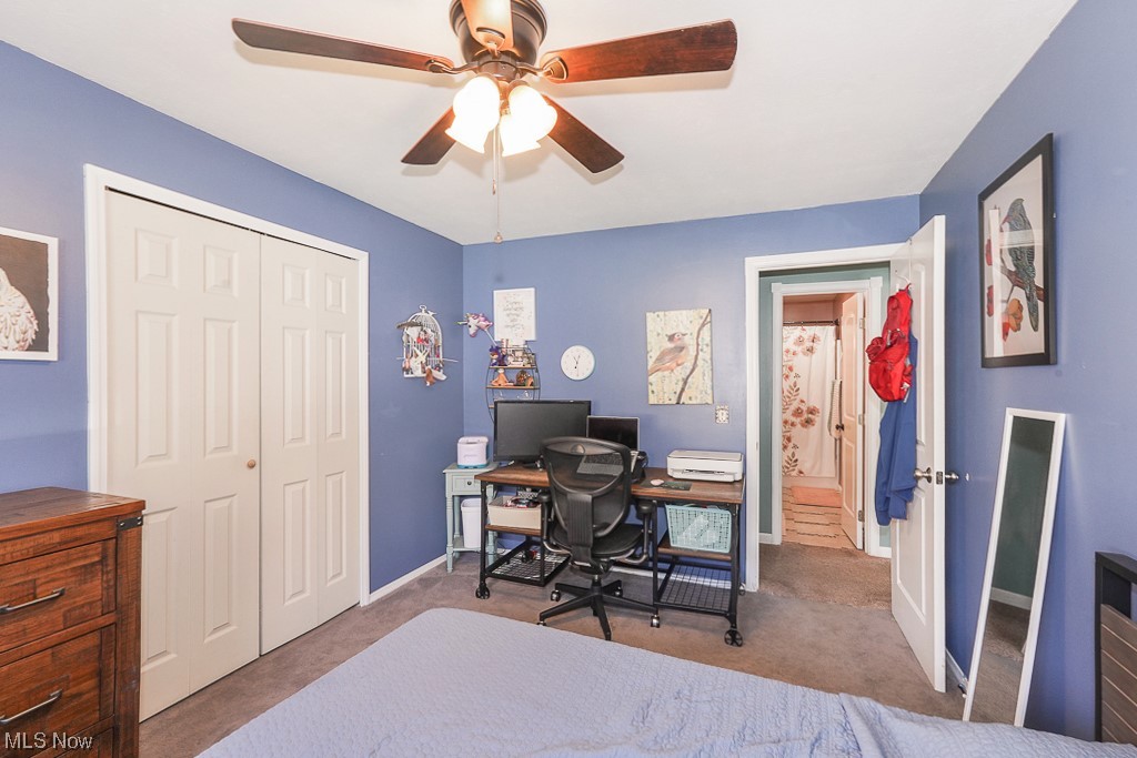 1127 Garden Road Willoughby, OH 44094 - Photo 27 of 33 Bedroom featuring a closet, ceiling fan, and dark colored carpet