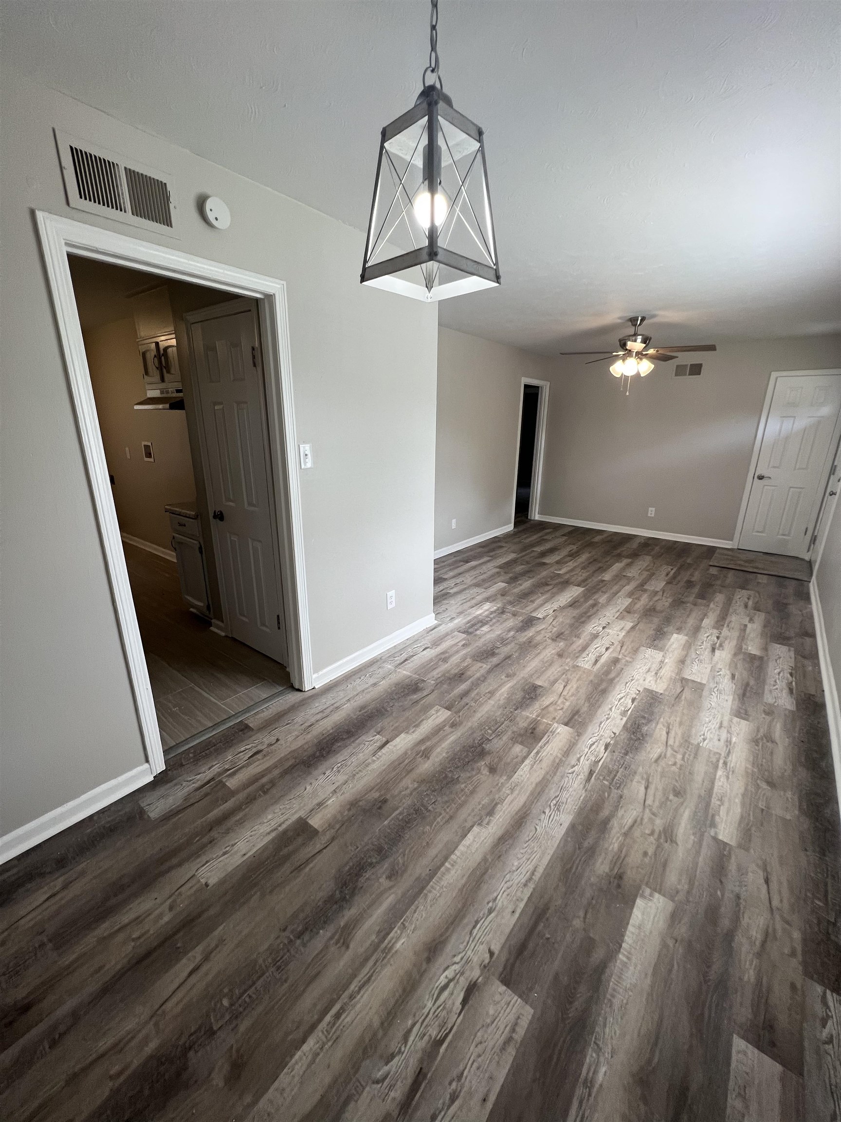 4224 Arrow Road Memphis, TN 38109 - Photo 3 of 11 a view of a livingroom with wooden floor and staircase