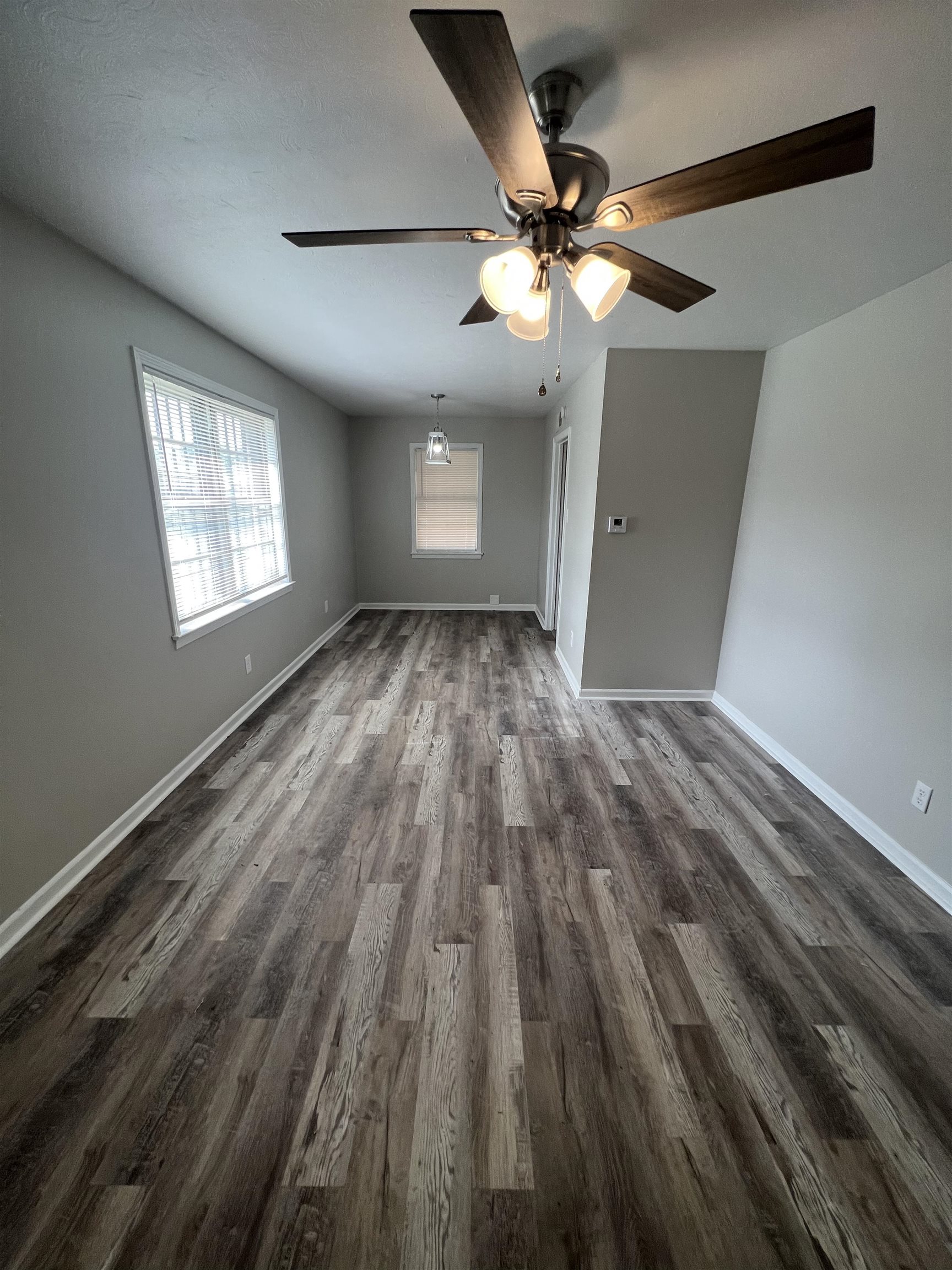 4224 Arrow Road Memphis, TN 38109 - Photo 4 of 11 wooden floor in an empty room with a window