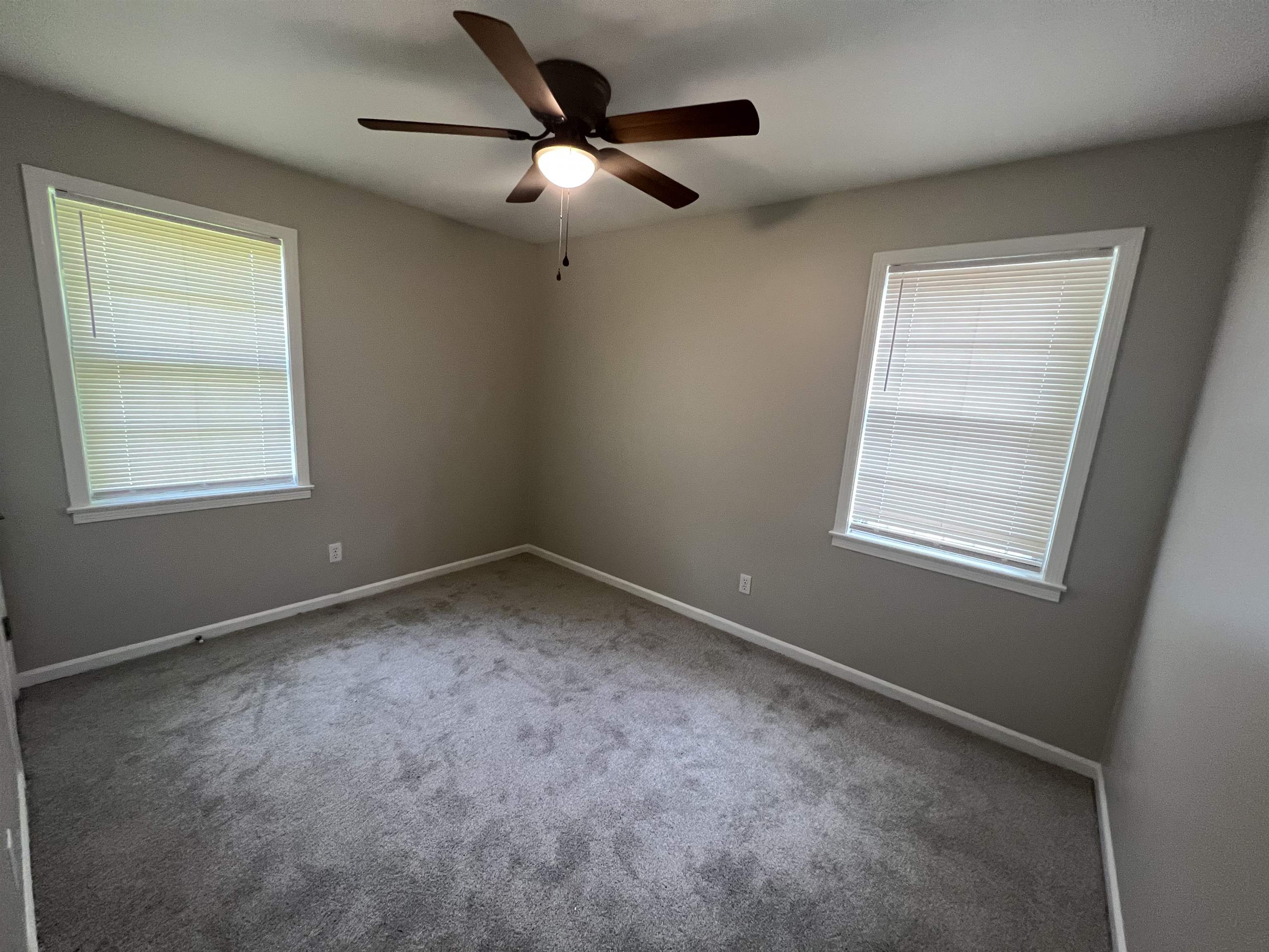 4224 Arrow Road Memphis, TN 38109 - Photo 8 of 11 an empty room with a window