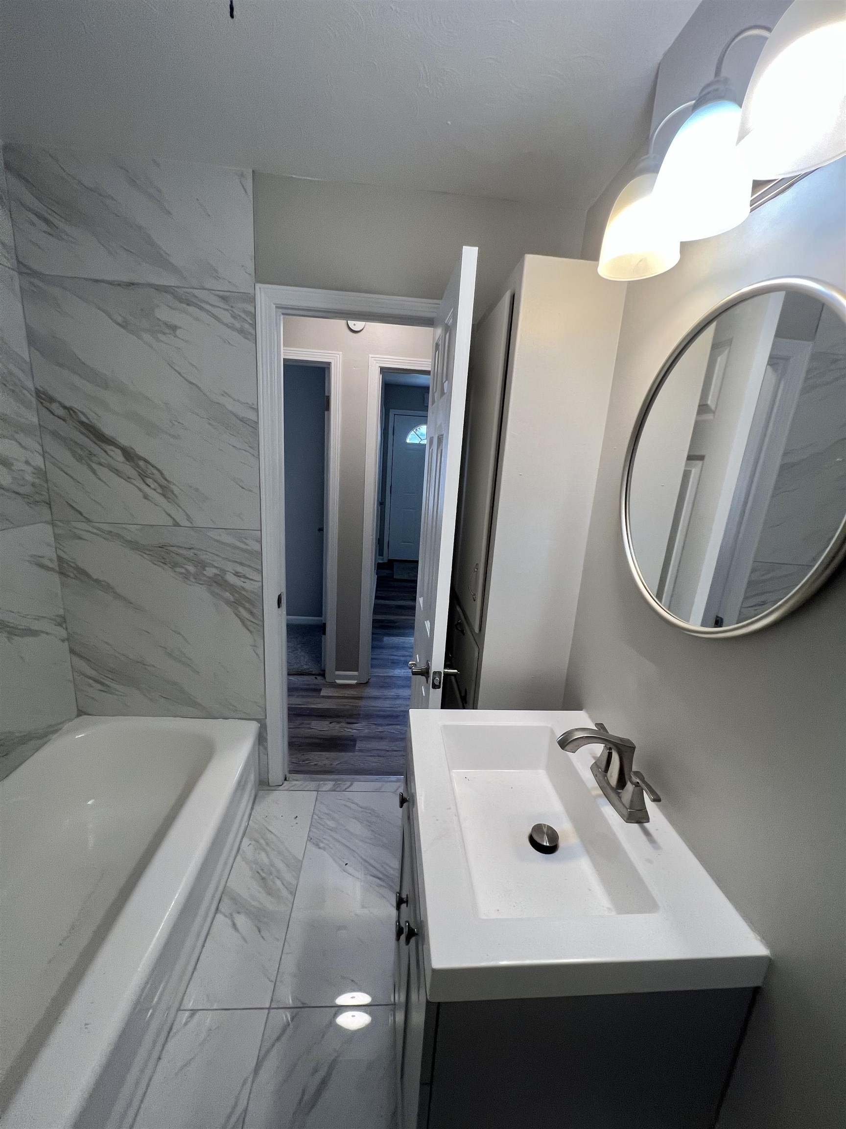 4224 Arrow Road Memphis, TN 38109 - Photo 10 of 11 a bathroom with a sink and a mirror