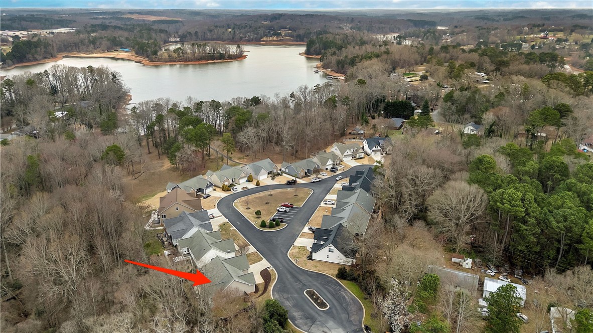 101 Riviera Circle Anderson, SC 29621 - Photo 30 of 35 This aerial view showcases a peaceful lakeside community with natural surroundings and charming residences.