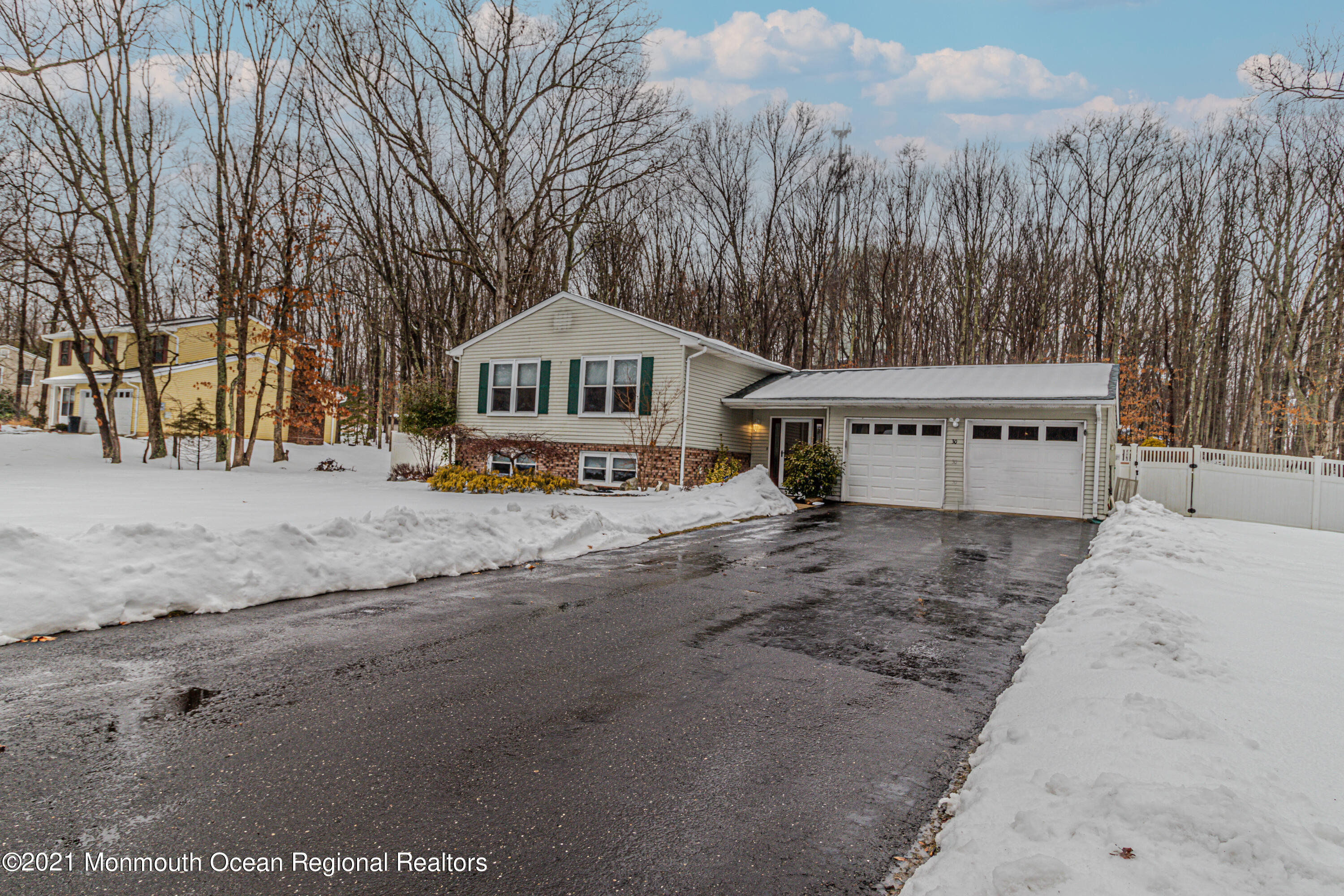 30 Eaglenest Road Freehold, NJ 07728 - Photo 2 of 39 a view of a house with a yard covered in snow