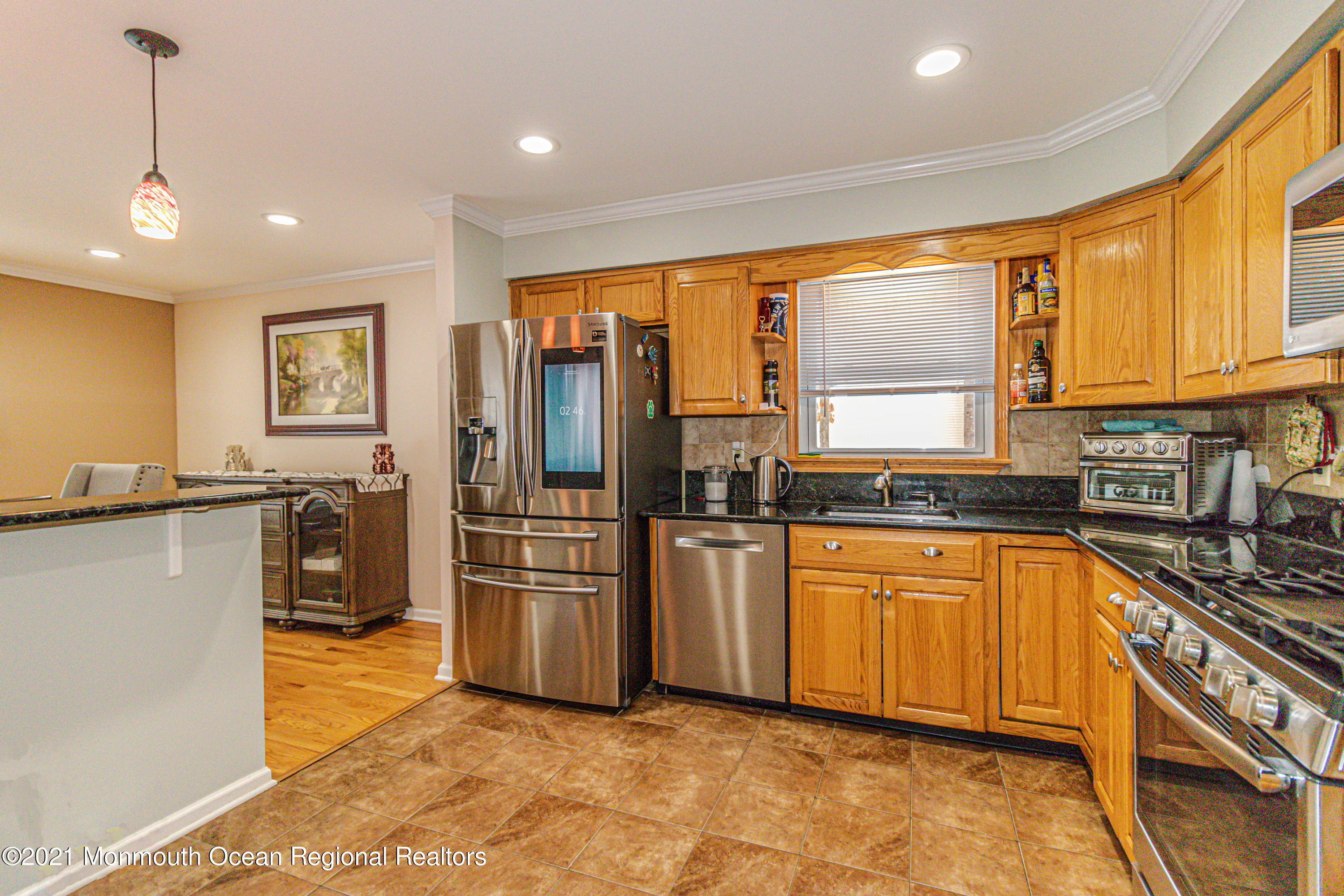30 Eaglenest Road Freehold, NJ 07728 - Photo 14 of 39 a kitchen with stainless steel appliances granite countertop a refrigerator and a stove top oven