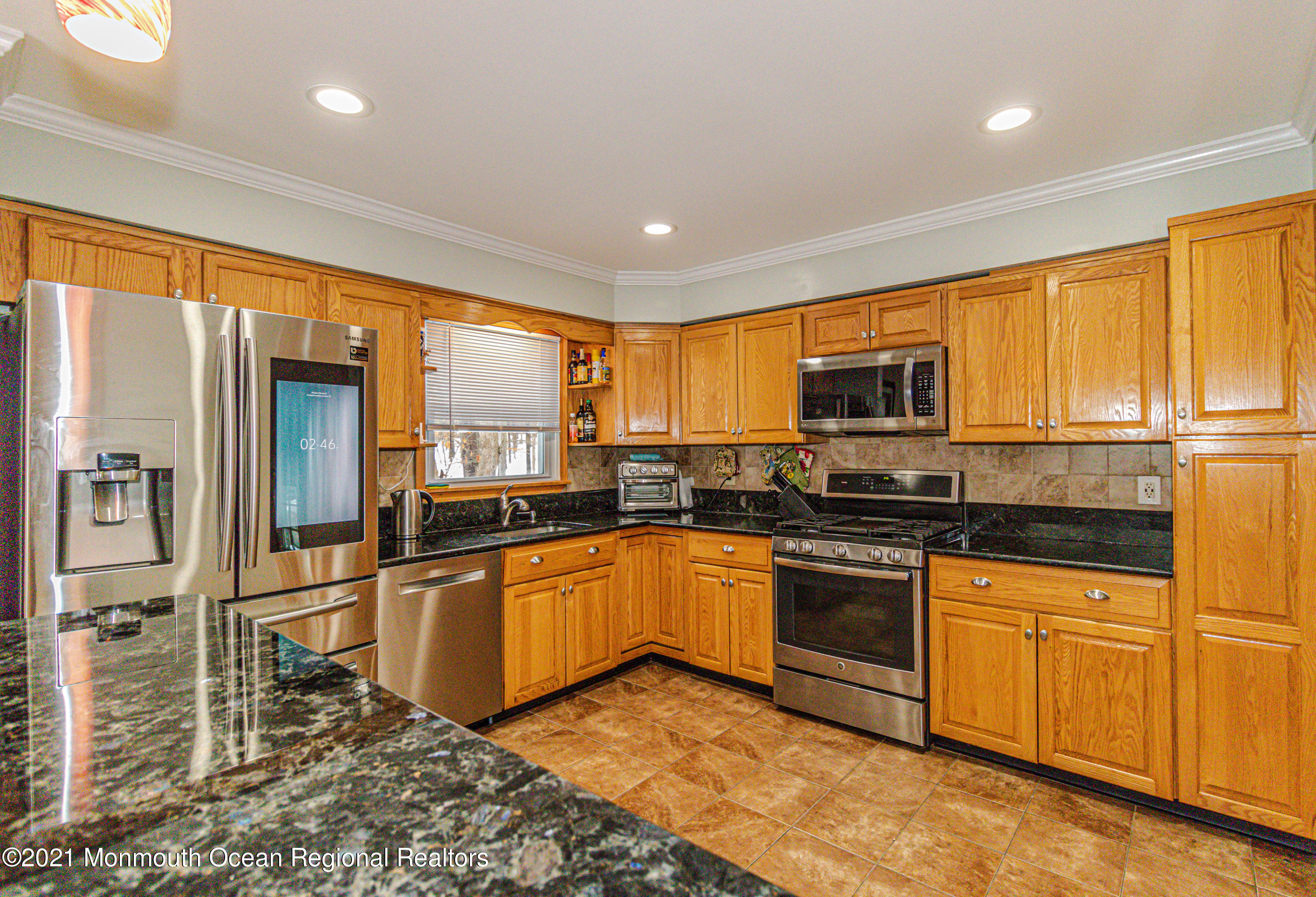 30 Eaglenest Road Freehold, NJ 07728 - Photo 15 of 39 a kitchen with stainless steel appliances granite countertop a refrigerator a stove top oven a sink and dishwasher