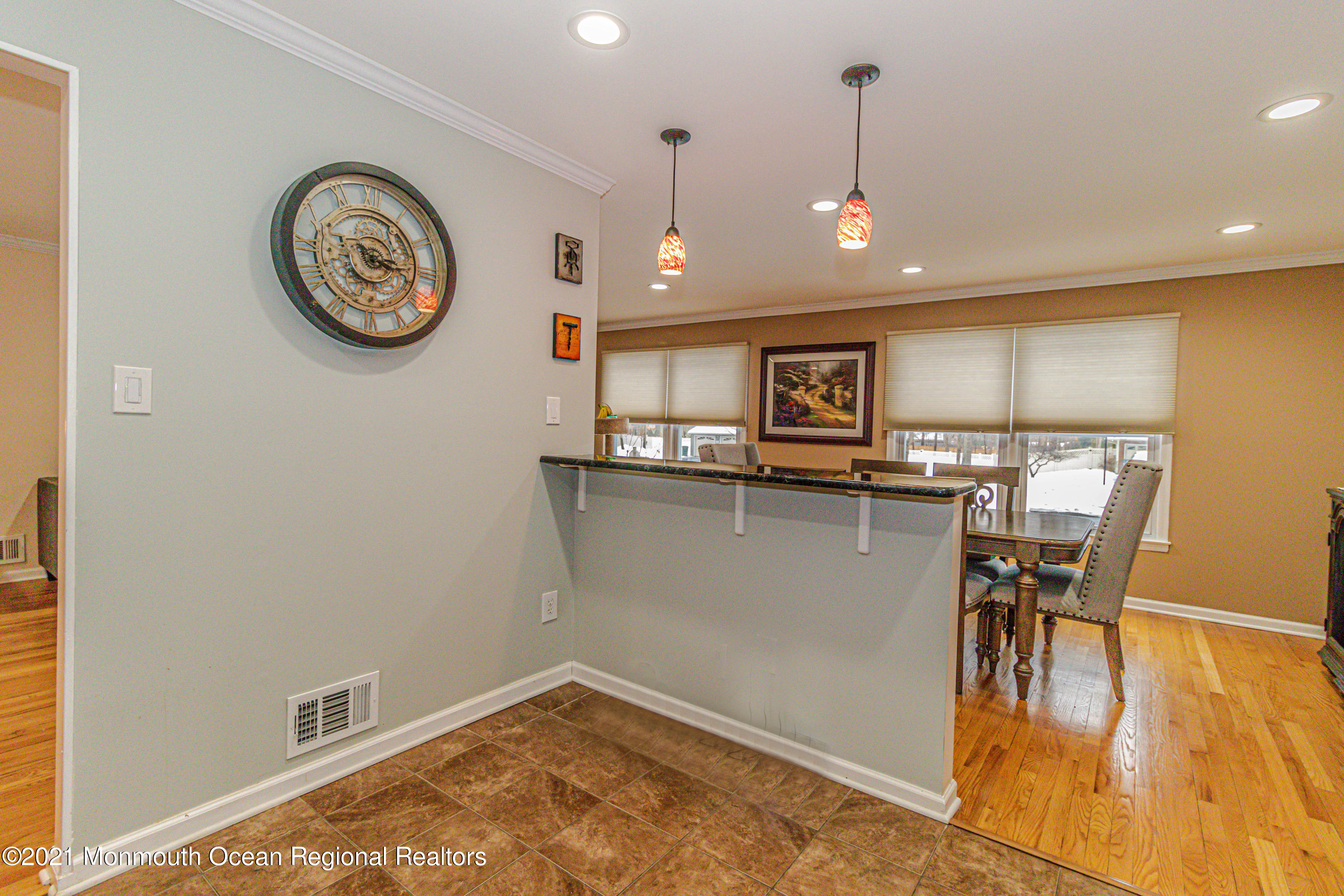 30 Eaglenest Road Freehold, NJ 07728 - Photo 18 of 39 a view of a kitchen with a table and chairs