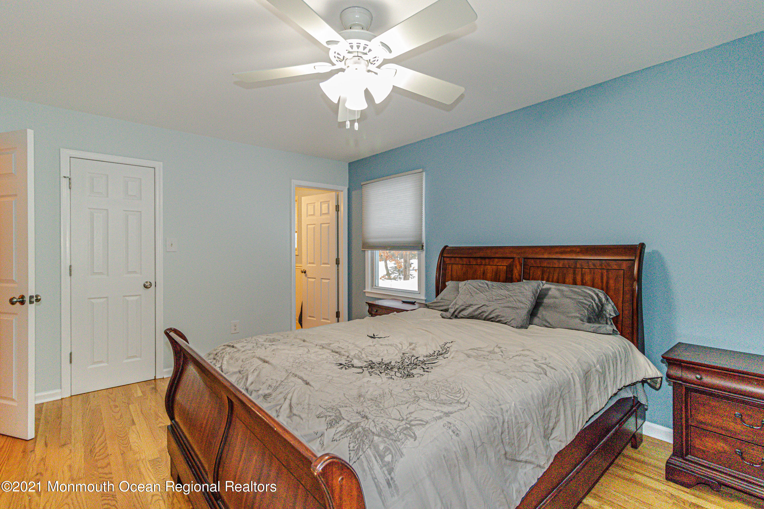 30 Eaglenest Road Freehold, NJ 07728 - Photo 20 of 39 a bedroom with a bed and a chandelier