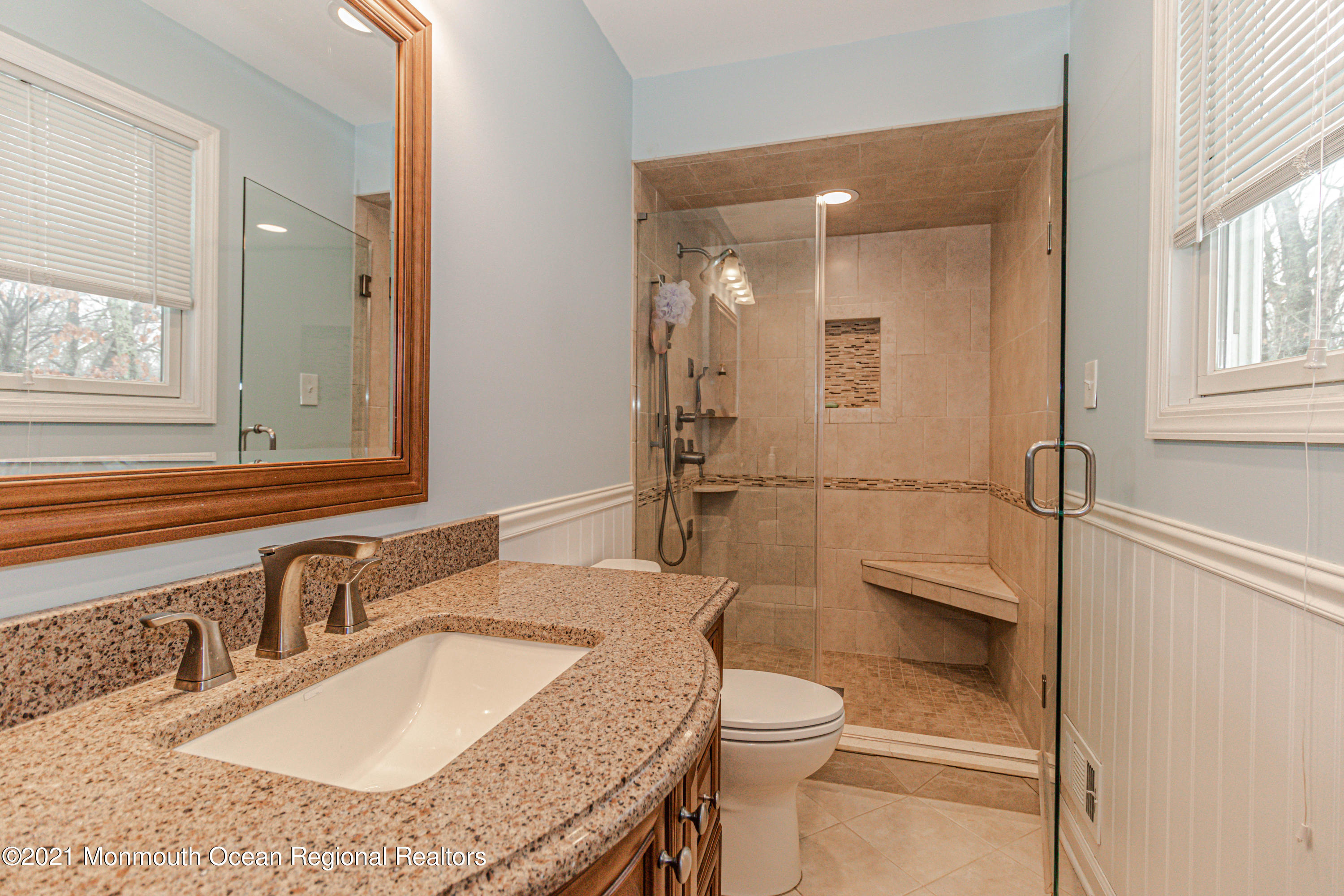 30 Eaglenest Road Freehold, NJ 07728 - Photo 22 of 39 a bathroom with a granite countertop sink a mirror and a toilet