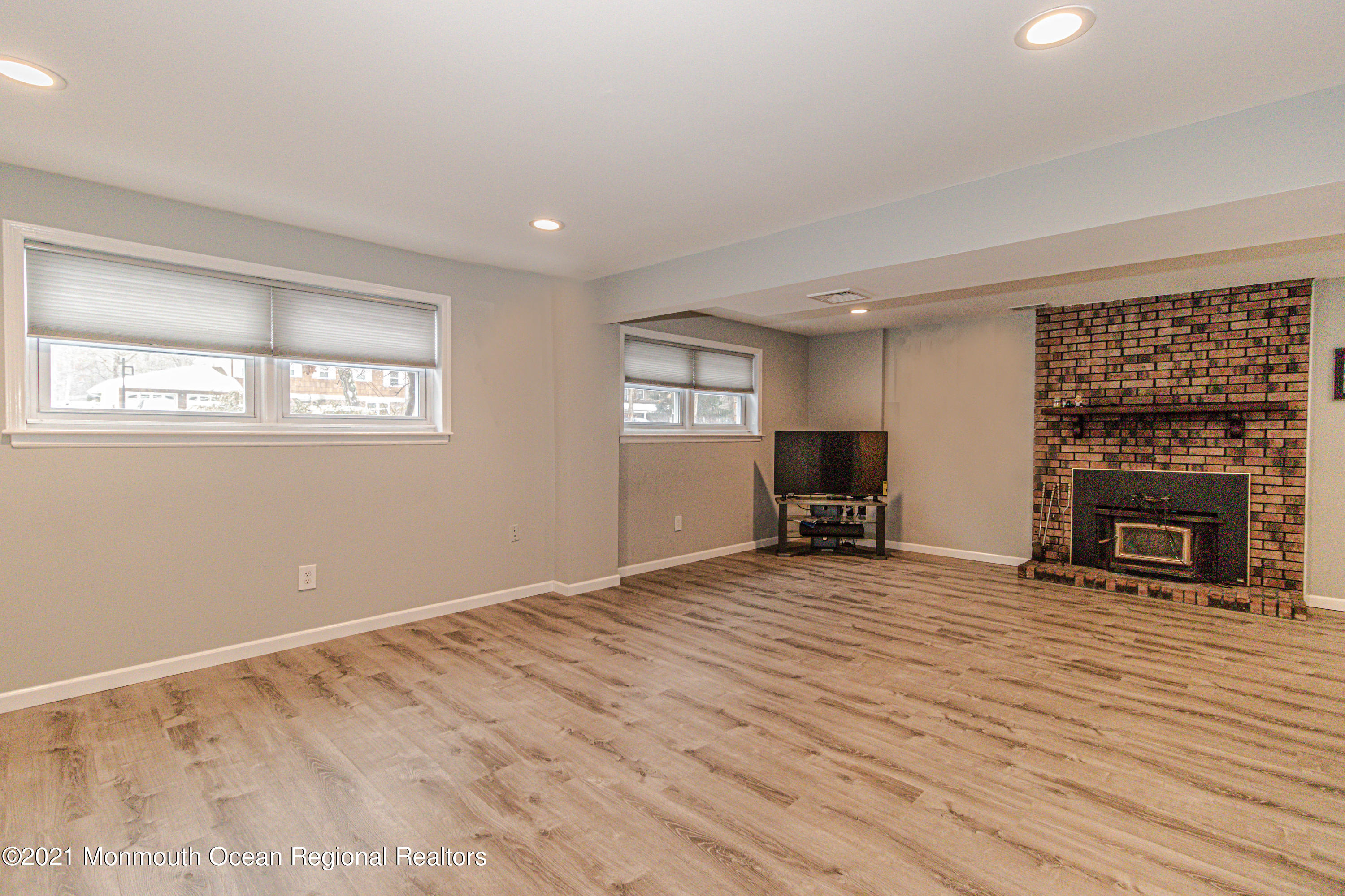 30 Eaglenest Road Freehold, NJ 07728 - Photo 26 of 39 a view of empty room with wooden floor and fireplace