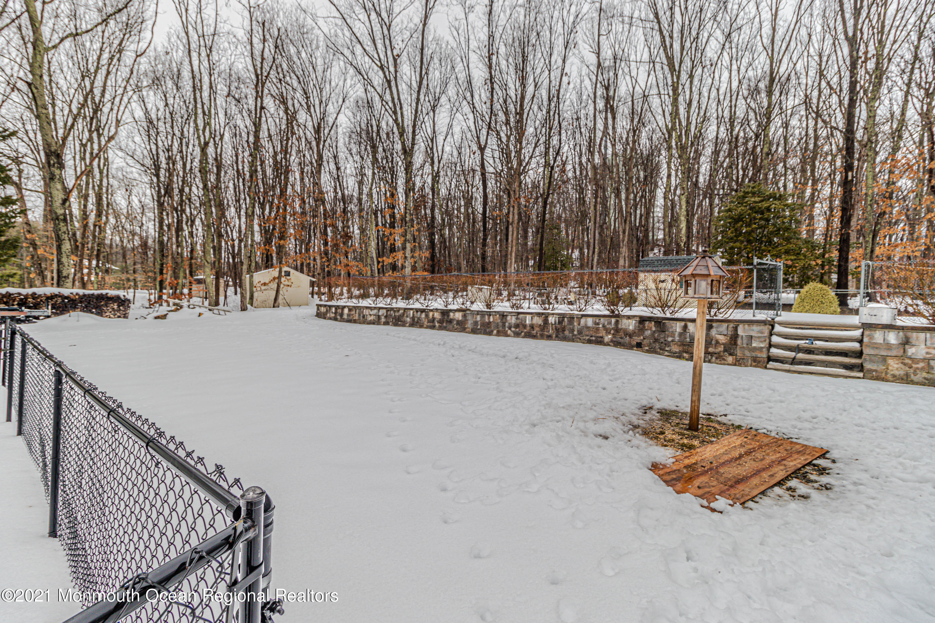 30 Eaglenest Road Freehold, NJ 07728 - Photo 35 of 39 a swimming pool with some trees in the background