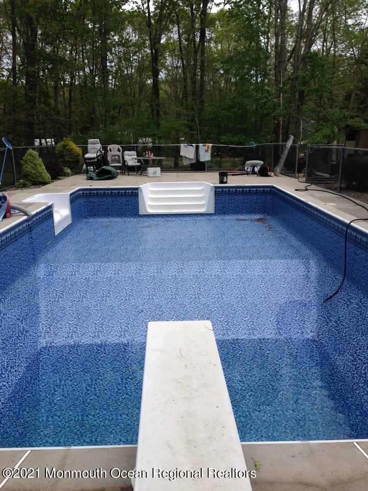 30 Eaglenest Road Freehold, NJ 07728 - Photo 38 of 39 a view of backyard with sitting area and outdoor seating