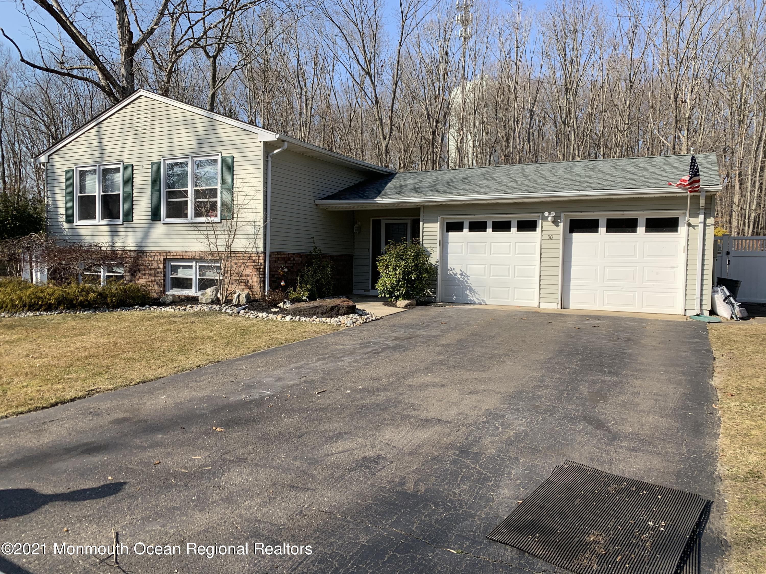 30 Eaglenest Road Freehold, NJ 07728 - Photo 39 of 39 a front view of a house with a yard