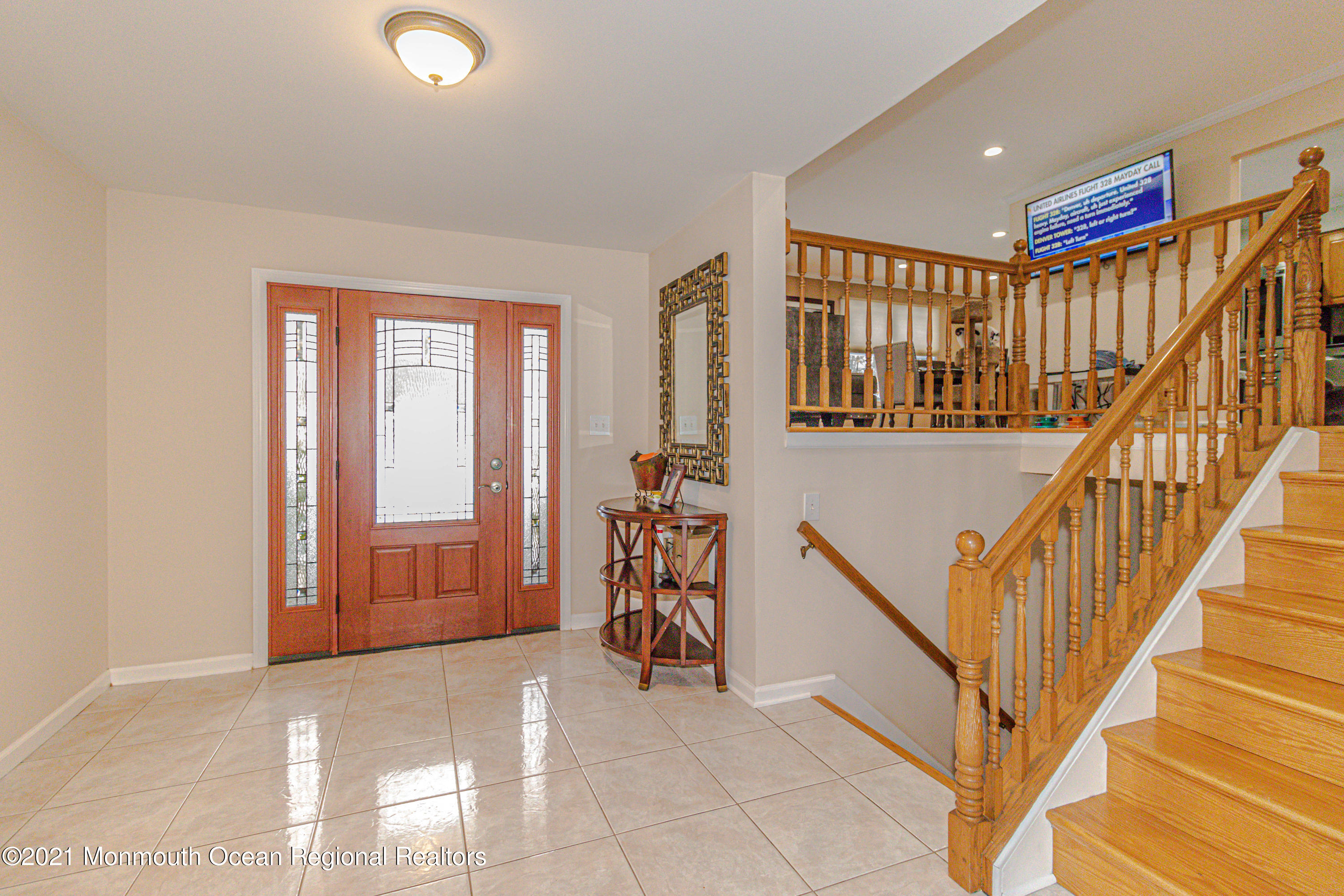 30 Eaglenest Road Freehold, NJ 07728 - Photo 7 of 39 a view of entryway with wooden floor and livingroom view