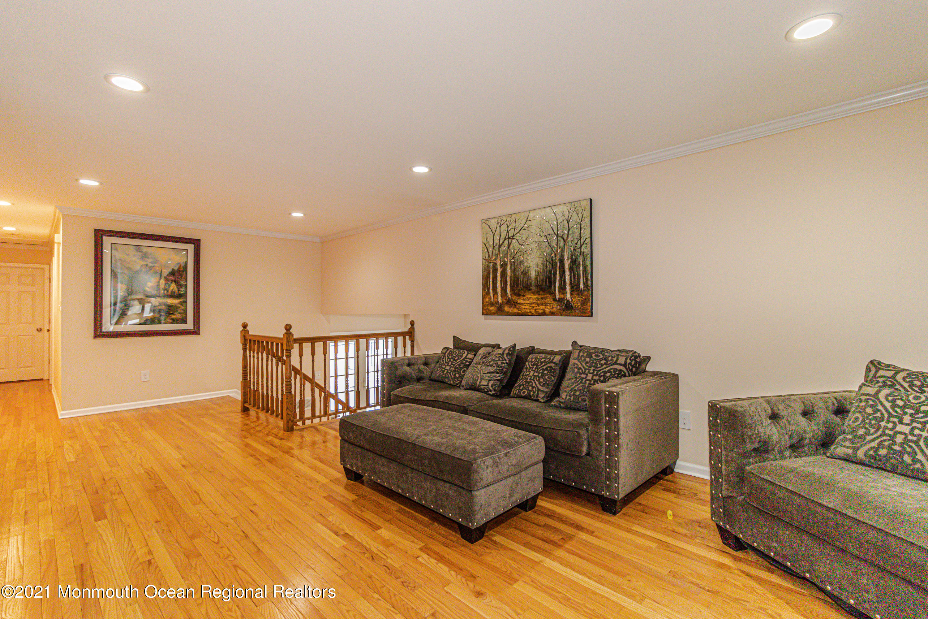 30 Eaglenest Road Freehold, NJ 07728 - Photo 8 of 39 a living room with furniture and a wooden floor