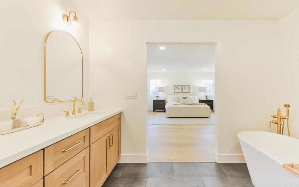 1520 Via Rancho Parkway Escondido, CA 92029 - Photo 56 of 89 a en suite bathroom with a double vanity sink and a mirror