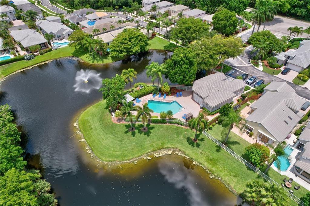 8171 Hampton Wood Drive Boca Raton, FL 33433 - Photo 45 of 56 an aerial view of a house with a yard and lake view