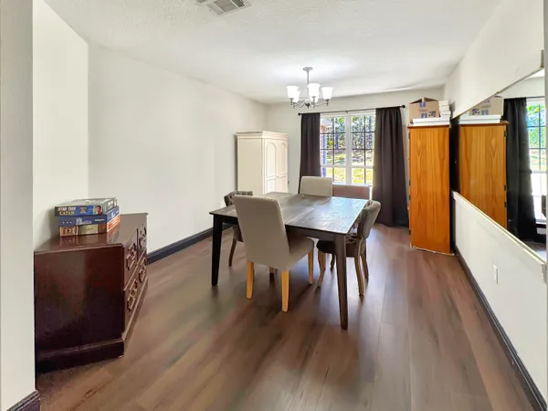 a bedroom with a bed and a television