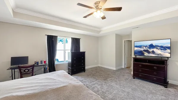a bed room with a bed and a window