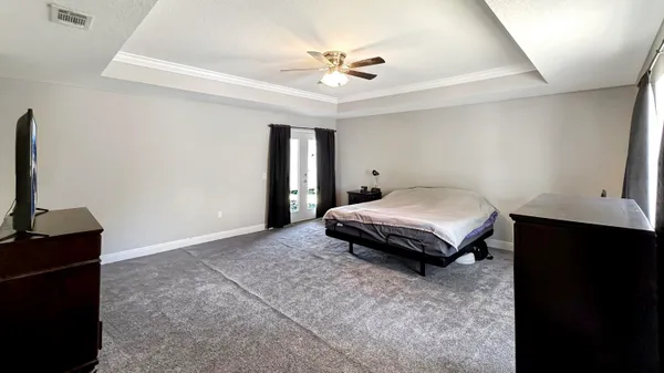 a spacious bathroom with a double vanity sink mirror and toilet