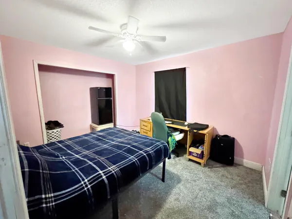 a living room with furniture and a bathroom