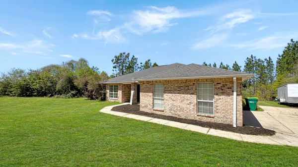 a view of a back yard with green space
