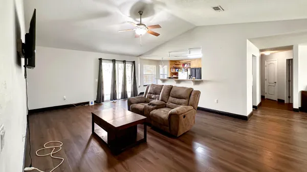 a living room with furniture and a window