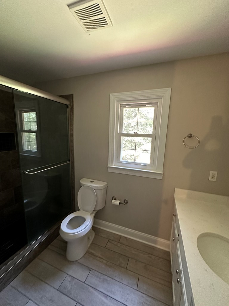 382 Worsham Road Culloden, GA 31016 - Photo 23 of 39 a white toilet sitting next to a bathroom sink