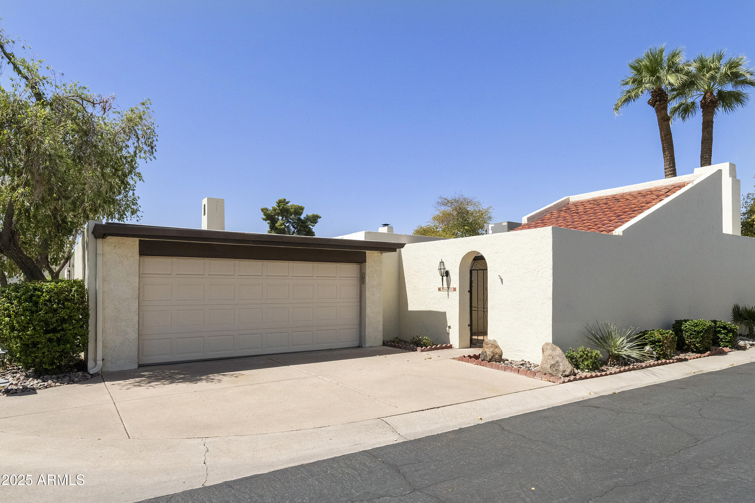 5622 North Palacio Way Phoenix, AZ 85014 - Photo 1 of 26 a front view of a house with a garage