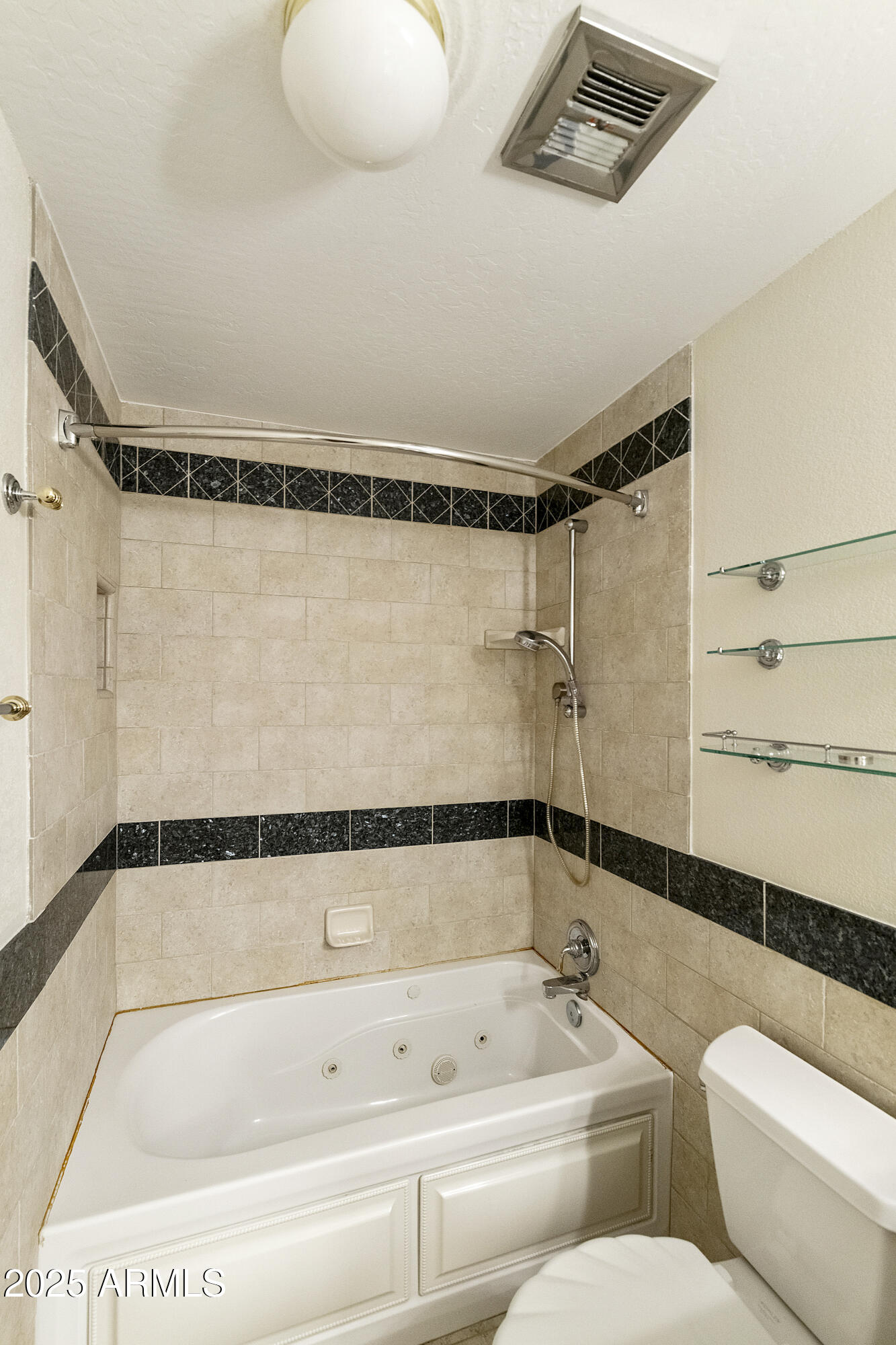 5622 North Palacio Way Phoenix, AZ 85014 - Photo 11 of 26 a bathroom with a shower and toilet