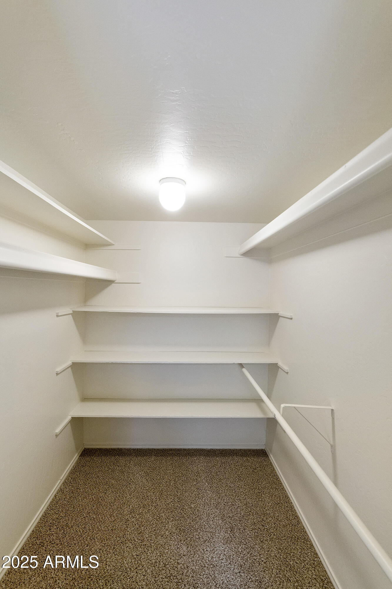 5622 North Palacio Way Phoenix, AZ 85014 - Photo 18 of 26 a storage room with empty racks