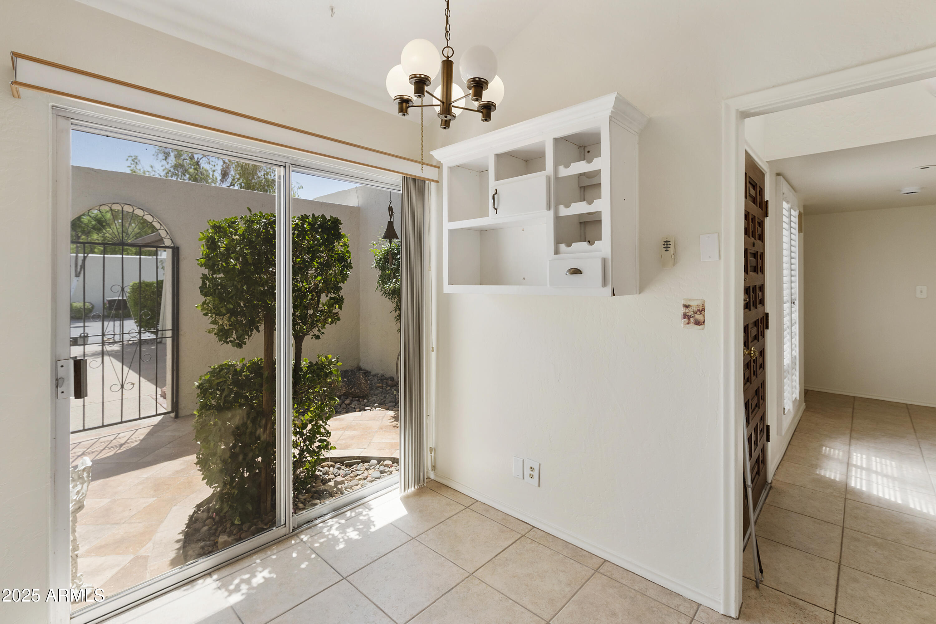 5622 North Palacio Way Phoenix, AZ 85014 - Photo 3 of 26 a view of a hallway with windows and chandelier