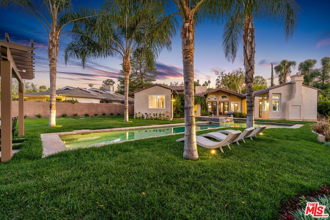 19261 Wells Drive Tarzana, CA 91356 - Photo 11 of 51 a view of a house with a swimming pool