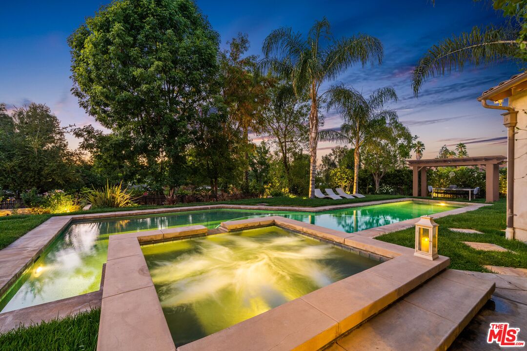 19261 Wells Drive Tarzana, CA 91356 - Photo 15 of 51 a view of swimming pool with outdoor seating