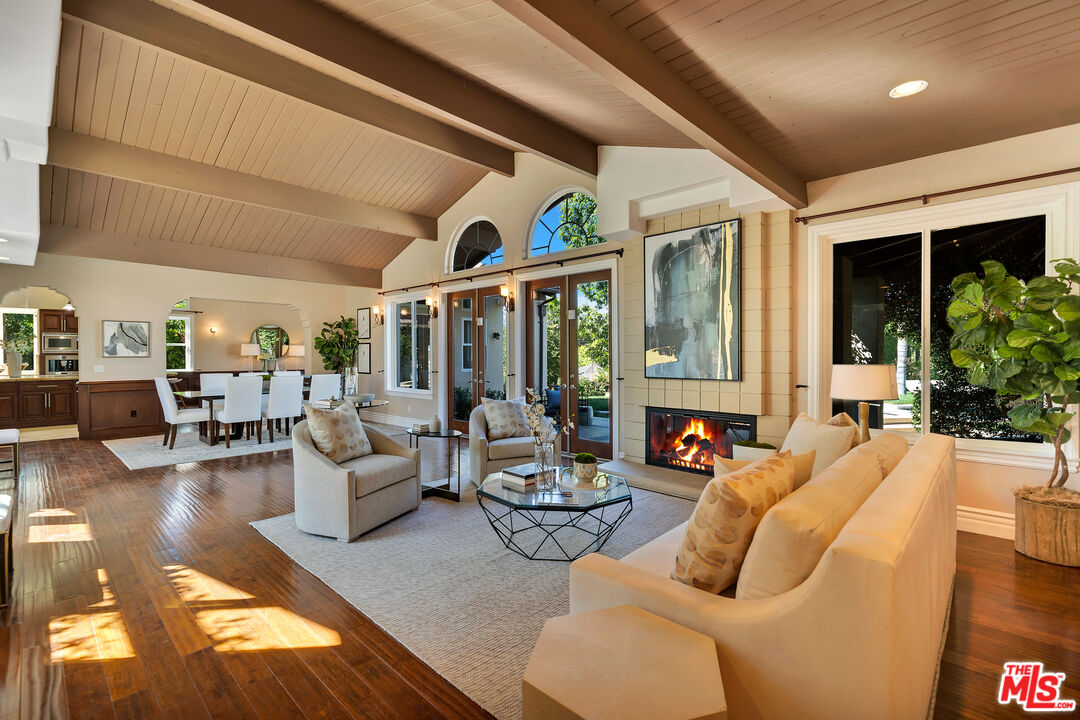 19261 Wells Drive Tarzana, CA 91356 - Photo 21 of 51 a living room with furniture and a large window