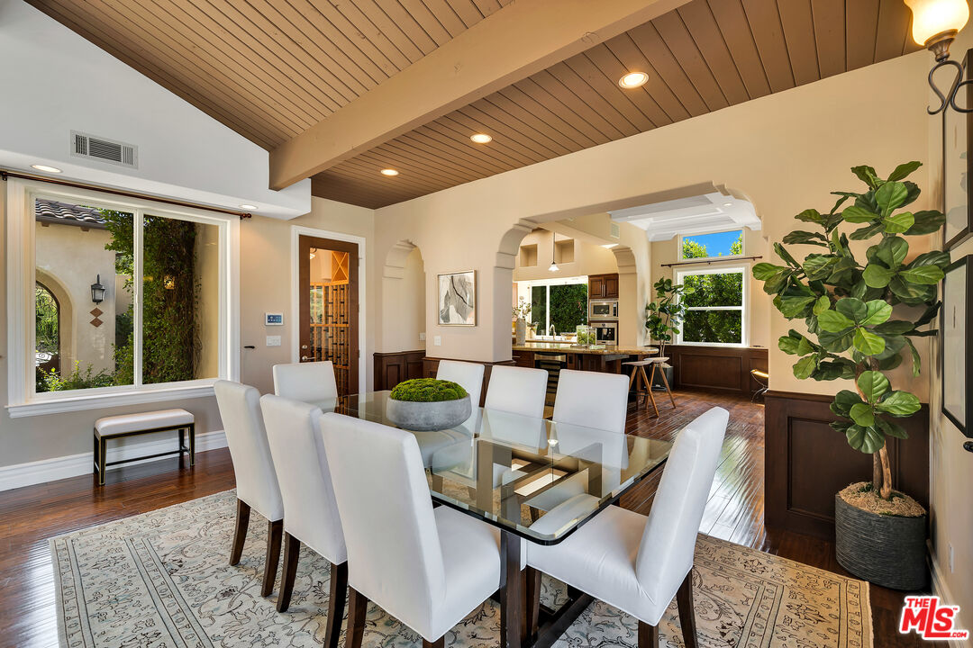 19261 Wells Drive Tarzana, CA 91356 - Photo 24 of 51 a view of a dining room with furniture window and wooden floor