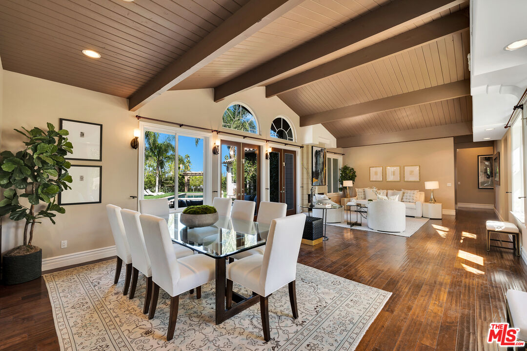 19261 Wells Drive Tarzana, CA 91356 - Photo 25 of 51 a dining room with furniture window and wooden floor