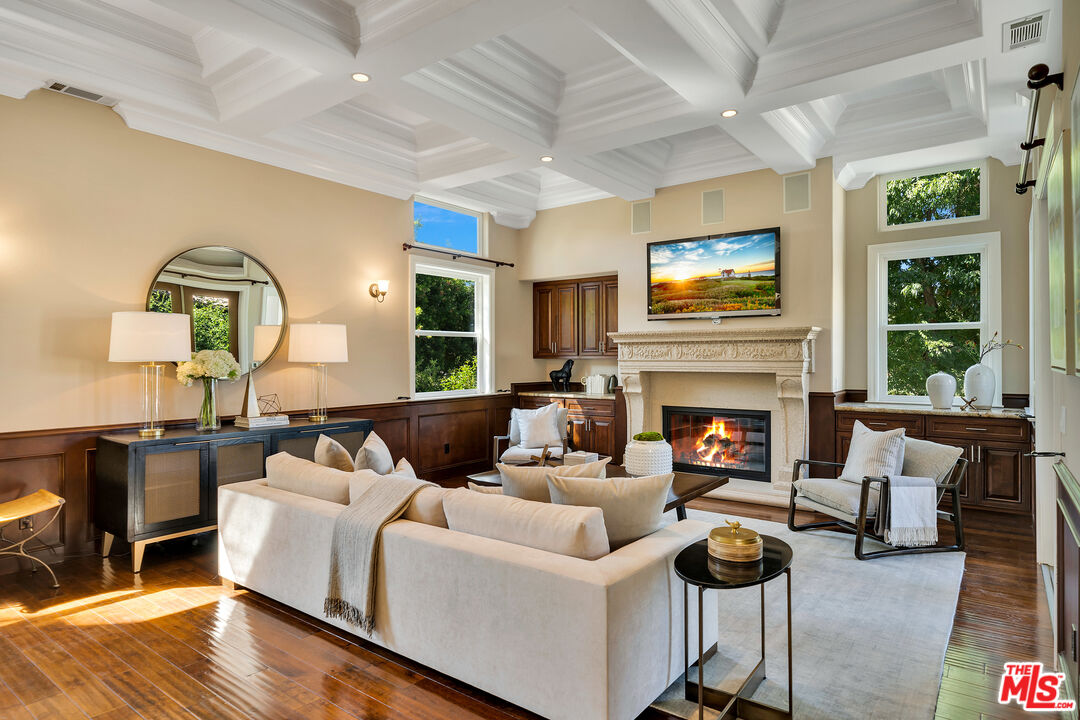 19261 Wells Drive Tarzana, CA 91356 - Photo 27 of 51 a living room with furniture fireplace and flat screen tv