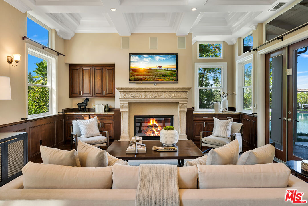 19261 Wells Drive Tarzana, CA 91356 - Photo 28 of 51 a living room with furniture and a fireplace
