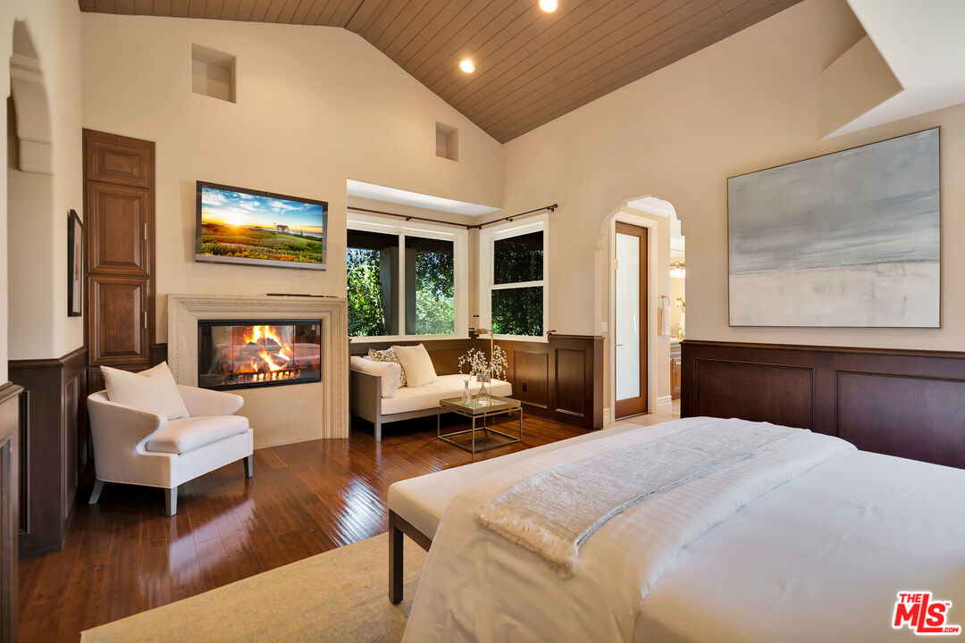 19261 Wells Drive Tarzana, CA 91356 - Photo 37 of 51 a bedroom with furniture and a fireplace