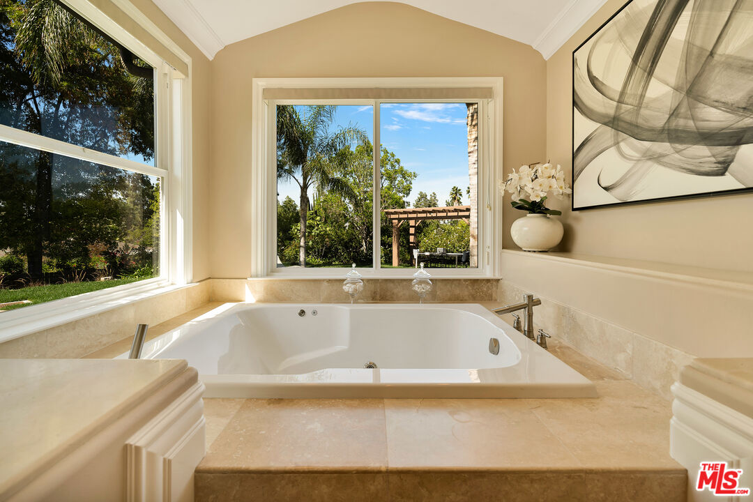 19261 Wells Drive Tarzana, CA 91356 - Photo 39 of 51 a bath tub sitting next to a window