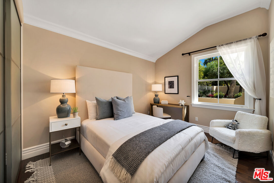 19261 Wells Drive Tarzana, CA 91356 - Photo 42 of 51 a bedroom with a bed and a large window