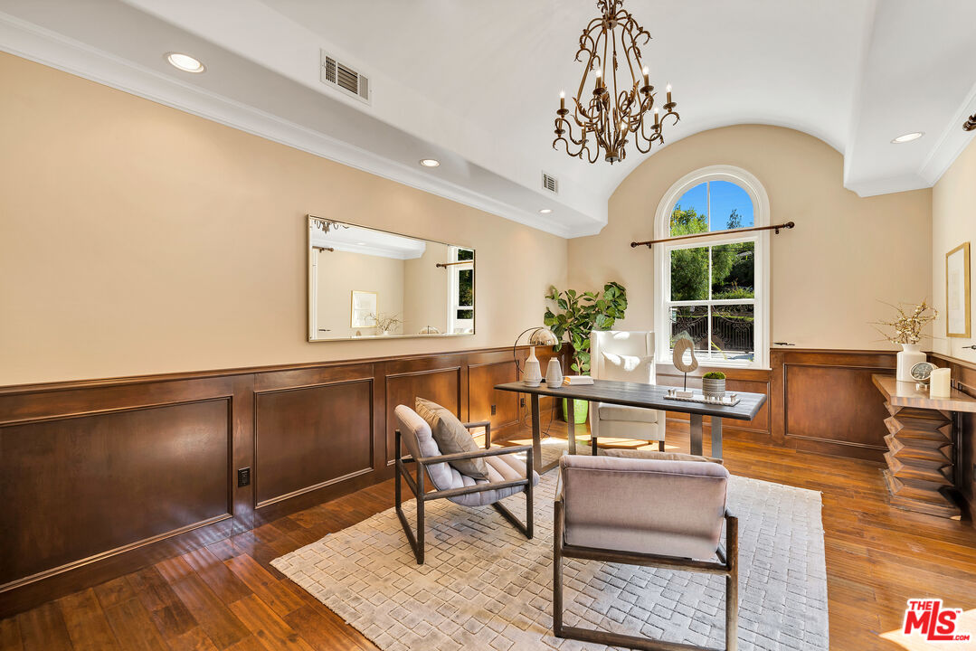 19261 Wells Drive Tarzana, CA 91356 - Photo 46 of 51 a living room with couches a dining table with kitchen view