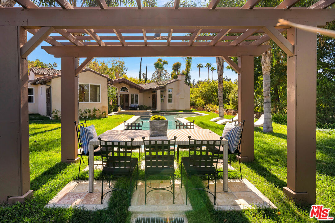 19261 Wells Drive Tarzana, CA 91356 - Photo 49 of 51 a view of swimming pool with outdoor seating