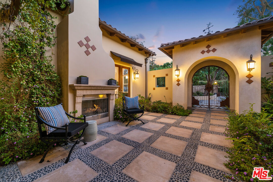 19261 Wells Drive Tarzana, CA 91356 - Photo 5 of 51 a view of a house with outdoor seating area