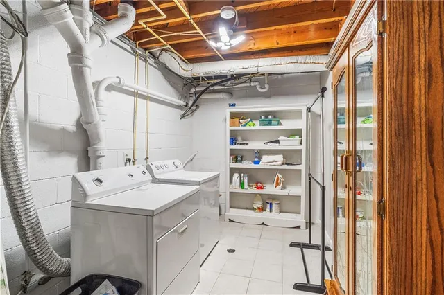 a utility room with dryer and washer
